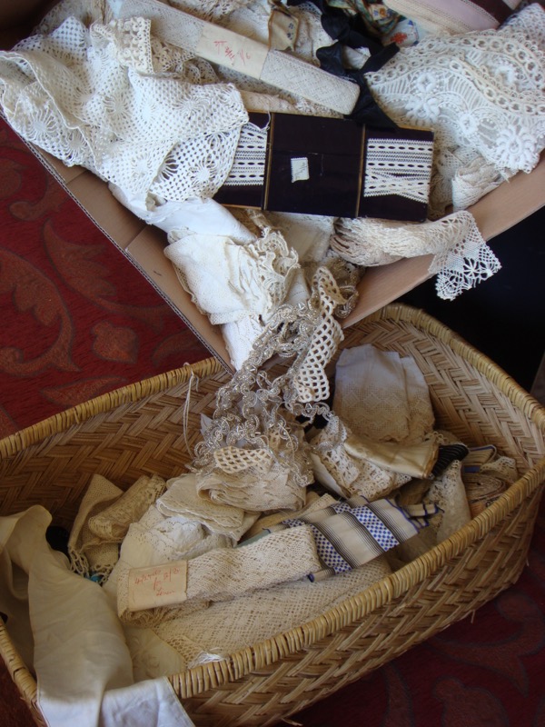 Lace, some handmade. Some pieces have 1/6d (one shilling and sixpence or 15 cents) & 2/6d (two and sixpence or 25 cents) on wrapper.