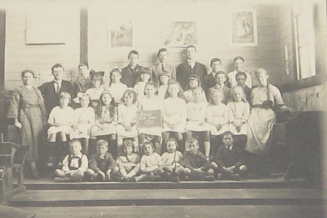 Okoia Bible School 1923 showing three of Louis Oliver's (1872-1938) children. Louis was the son of Samuel and Janet Oliver. Harold Oliver rear second from left. Gordon Oliver rear third from left in front of pillar. Charles Oliver very back-centre. Muriel Oliver front-middle. Bruce Oliver front-right.