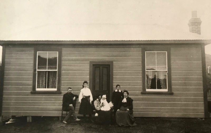 Orpha Shute (nee Williams), seated on right in front of her house in Mataroa, apparently in 1913. (May be earlier)? From left is James Alexander Oliver, Lena Llewella Shute, Ness Oliver (nee Shute) with baby (maybe Noel Nester Oliver if photo taken in 1913), Tom Errol Llewellyn Shute, and Orpha Shute herself.