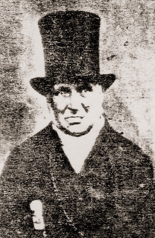 James Florance, father of Dr. Augustus Florance, wears a top hat.